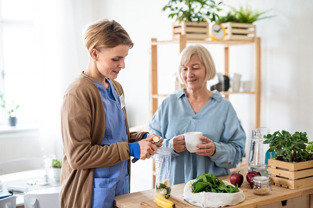 Support worker assisting an NDIS participant during daily activities.